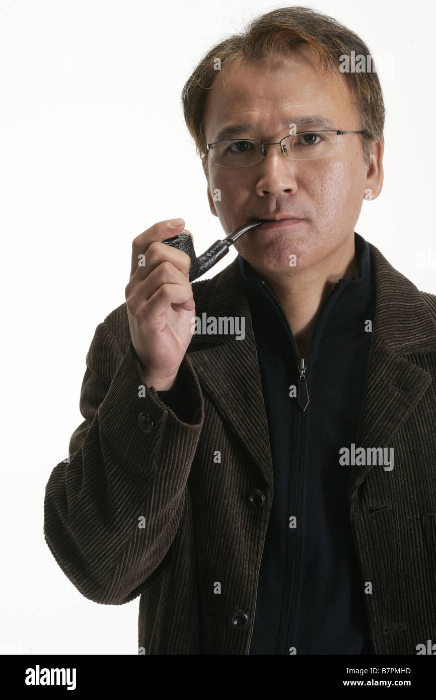 A man smoking the pipe Stock Photo Alamy