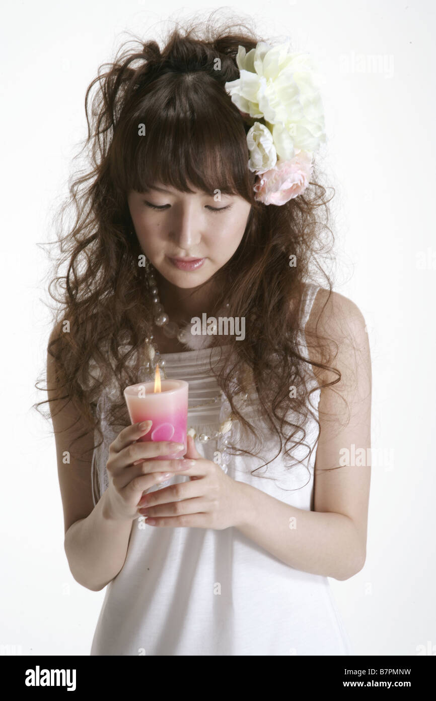 A bride staring at a candle Stock Photo