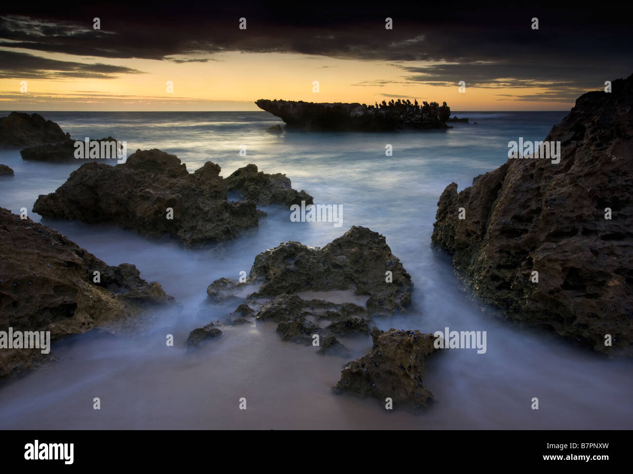A long exposure after sunset of Cormorant Rock at Trigg Beach, Perth