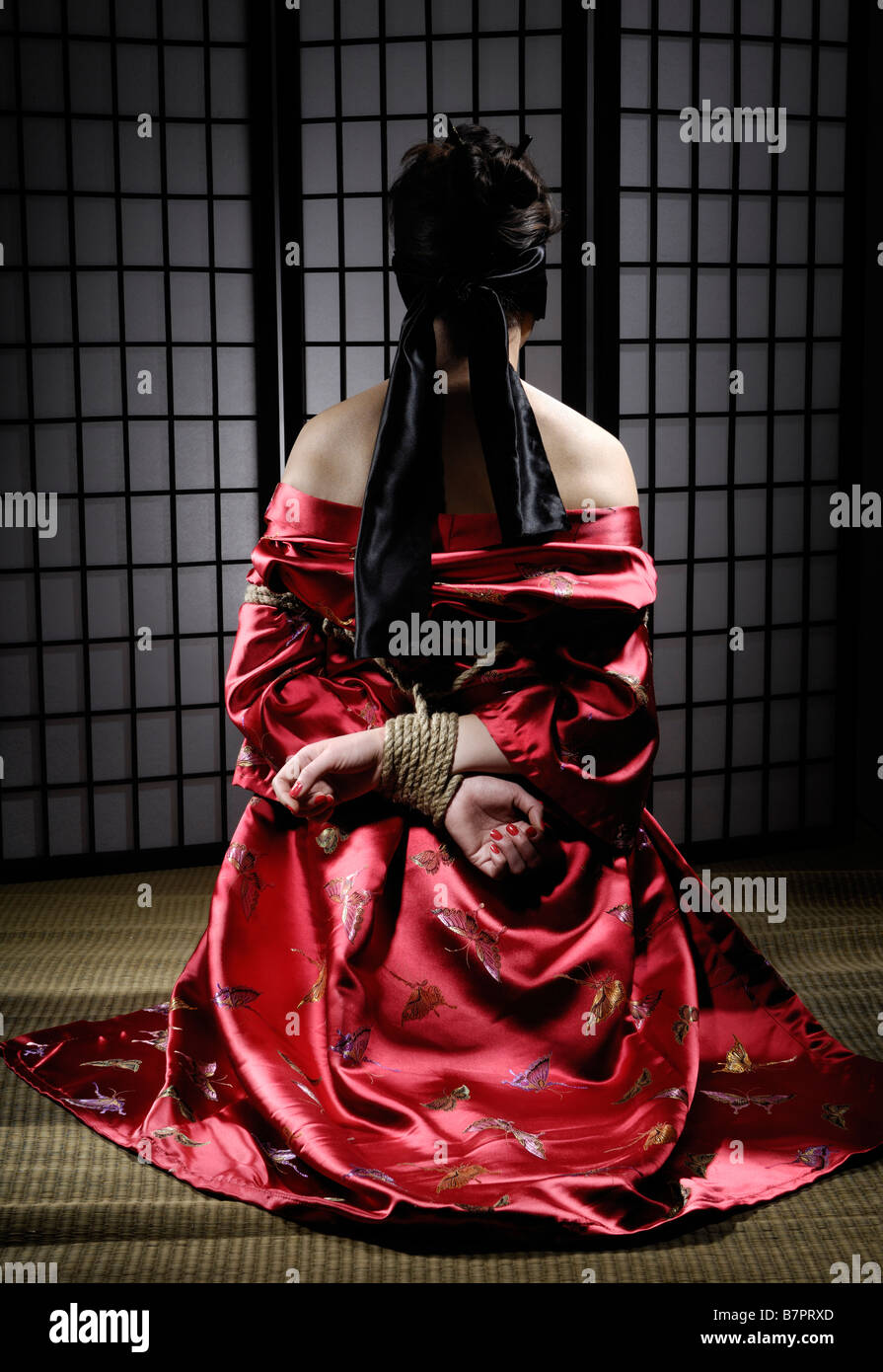 Asian woman in kimono with her hands tied behind her back Stock Photo -  Alamy