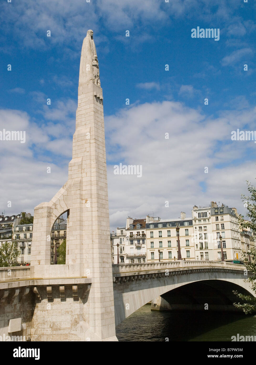 Tall statue of Saint Genevieve on Pont de la Tournelle Paris France Europe Stock Photo