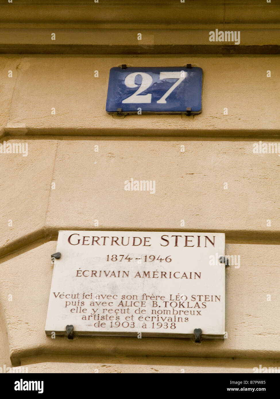 A plaque outside of 27 Rue du Fleurus, the Paris home of American Writer and Poet Gertrude Stein, France Europe Stock Photo