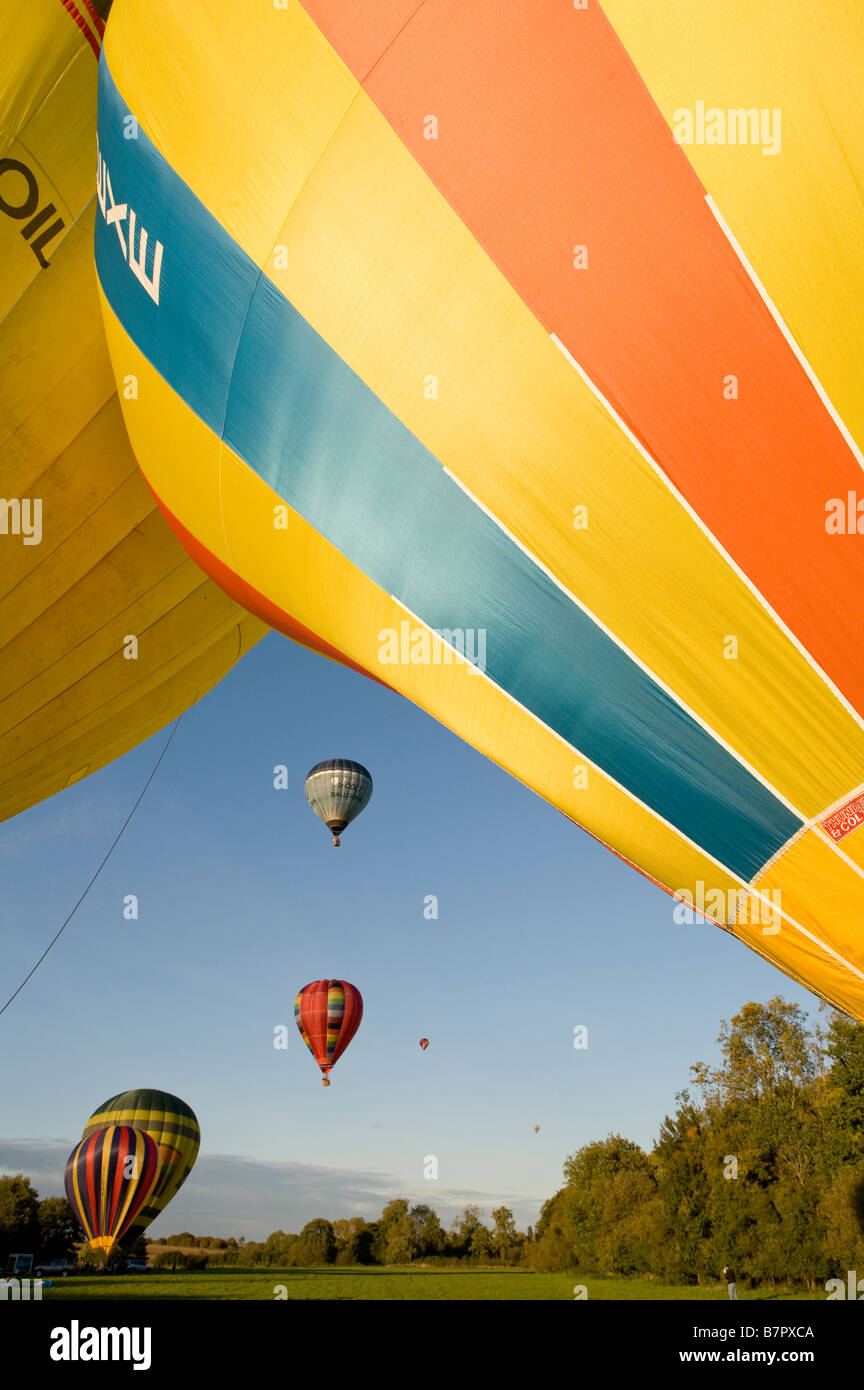 Colourful hot air balloons taking off against a bright blue sky Stock ...