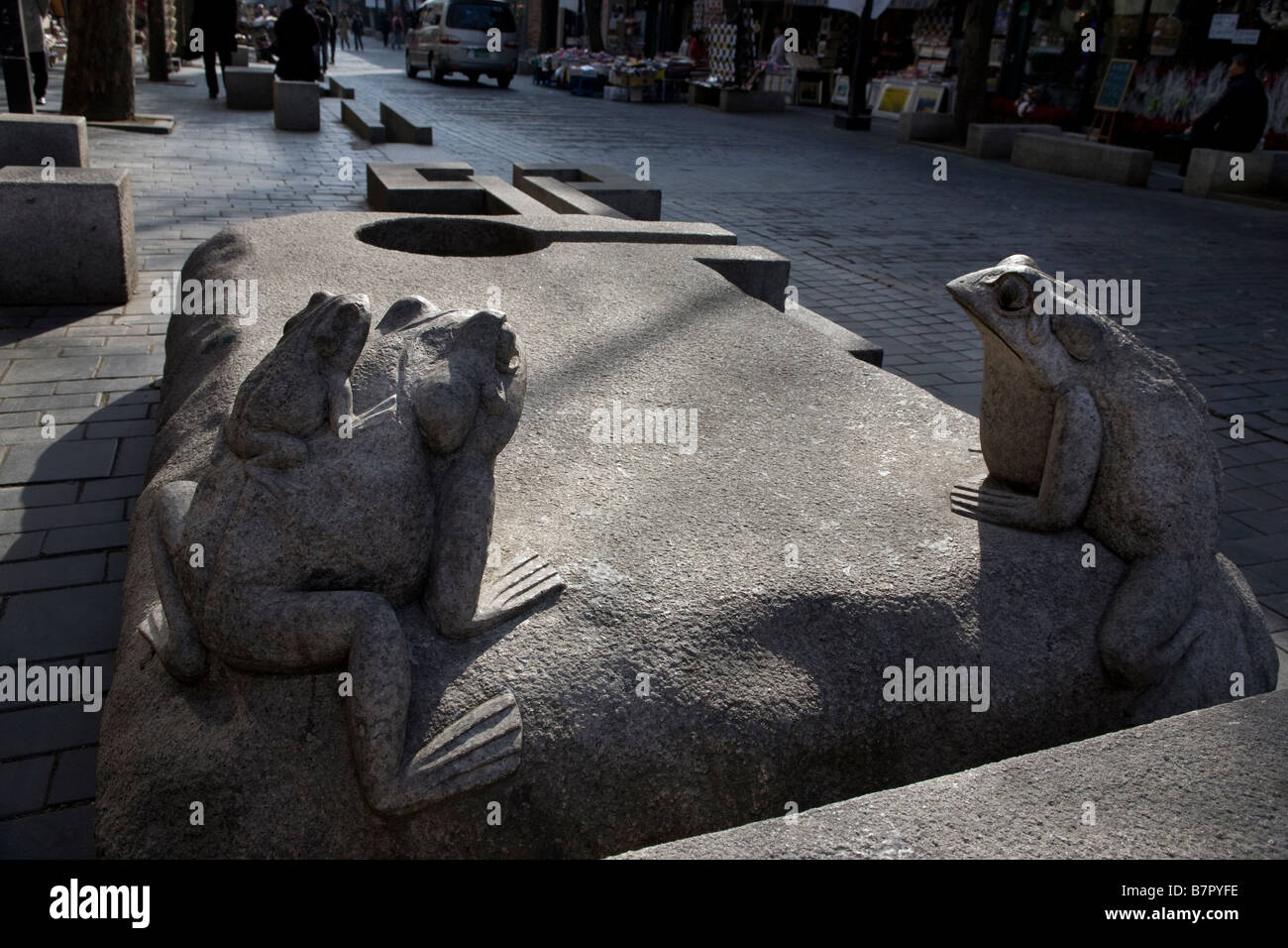 Frog sculpture on bench Insasong Seoul Korea Stock Photo