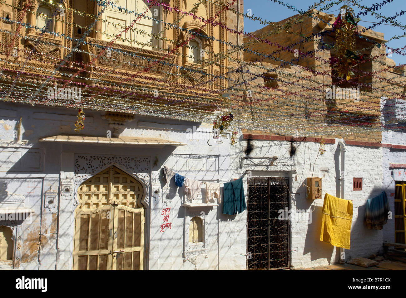 haveli in the backstreets of the old city of jaisalmer with traditional indian street wedding decorations Stock Photo