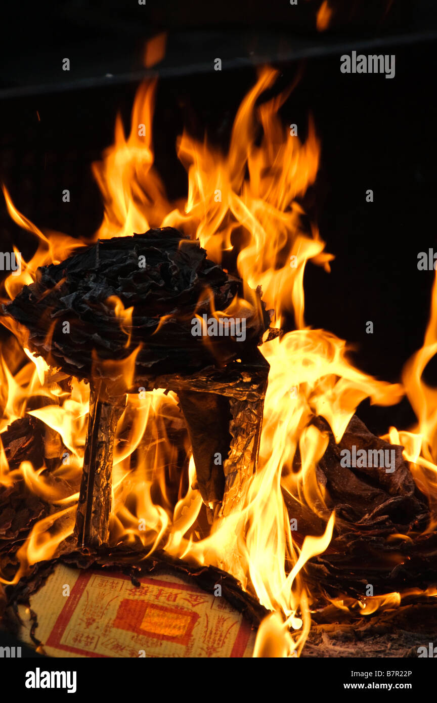 Hell money being burned so that the dead will have cash in the afterlife Stock Photo