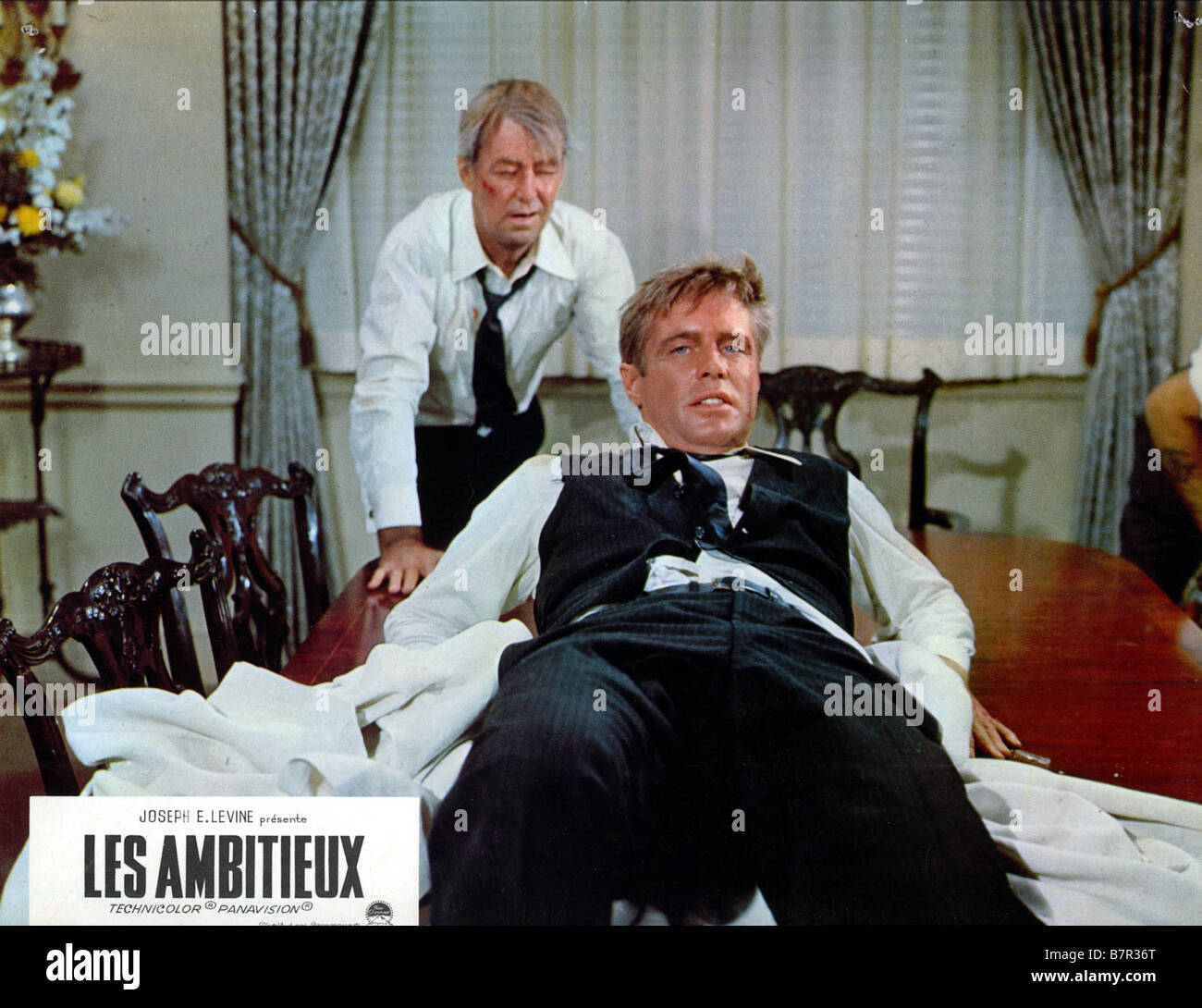 The Carpetbaggers  Year: 1964 USA Directed by Edward Dmytryk Alan Ladd, George Peppard Stock Photo