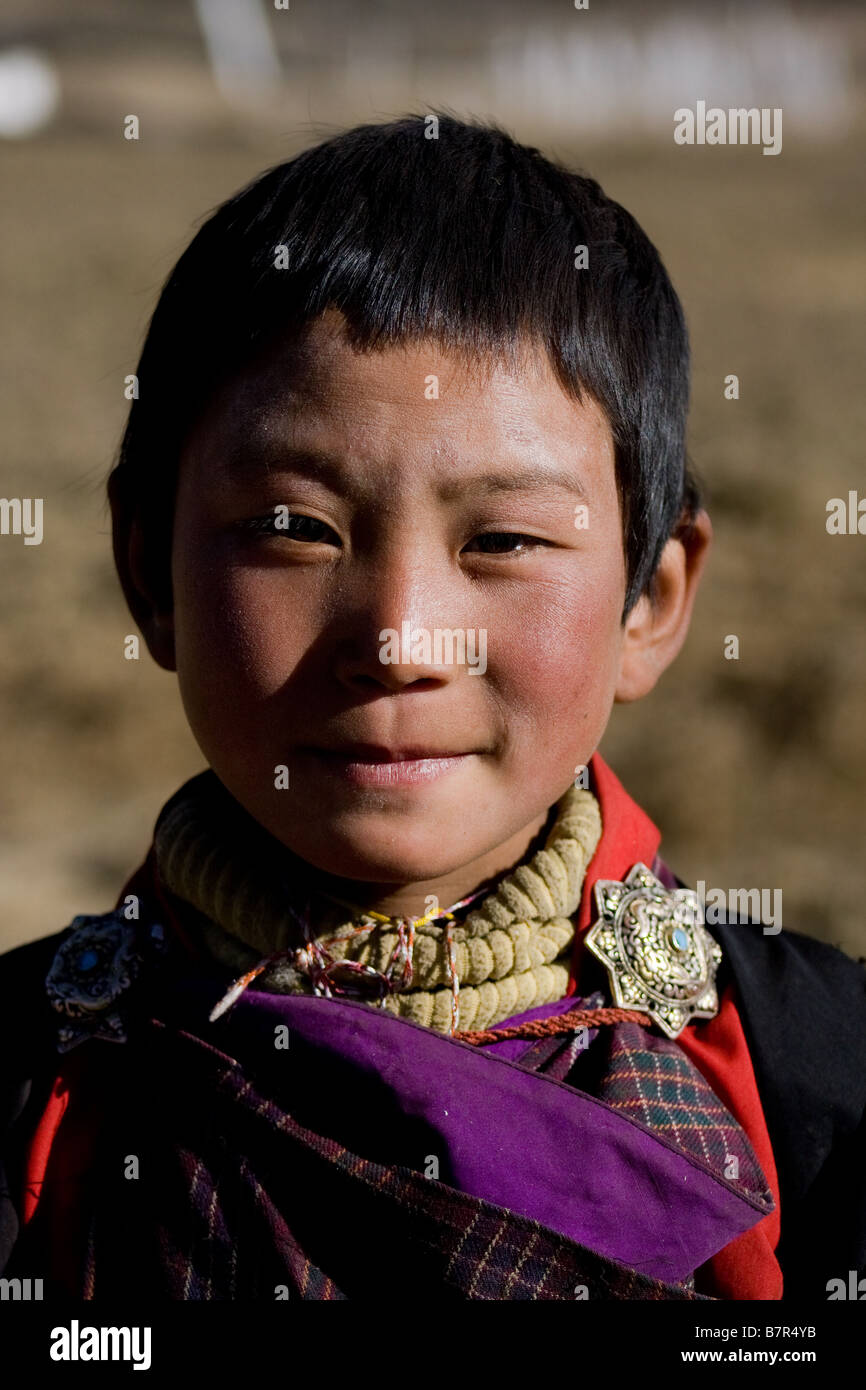 Portrait of Bhutanese boy in traditional clothing, Gangtey valley ...