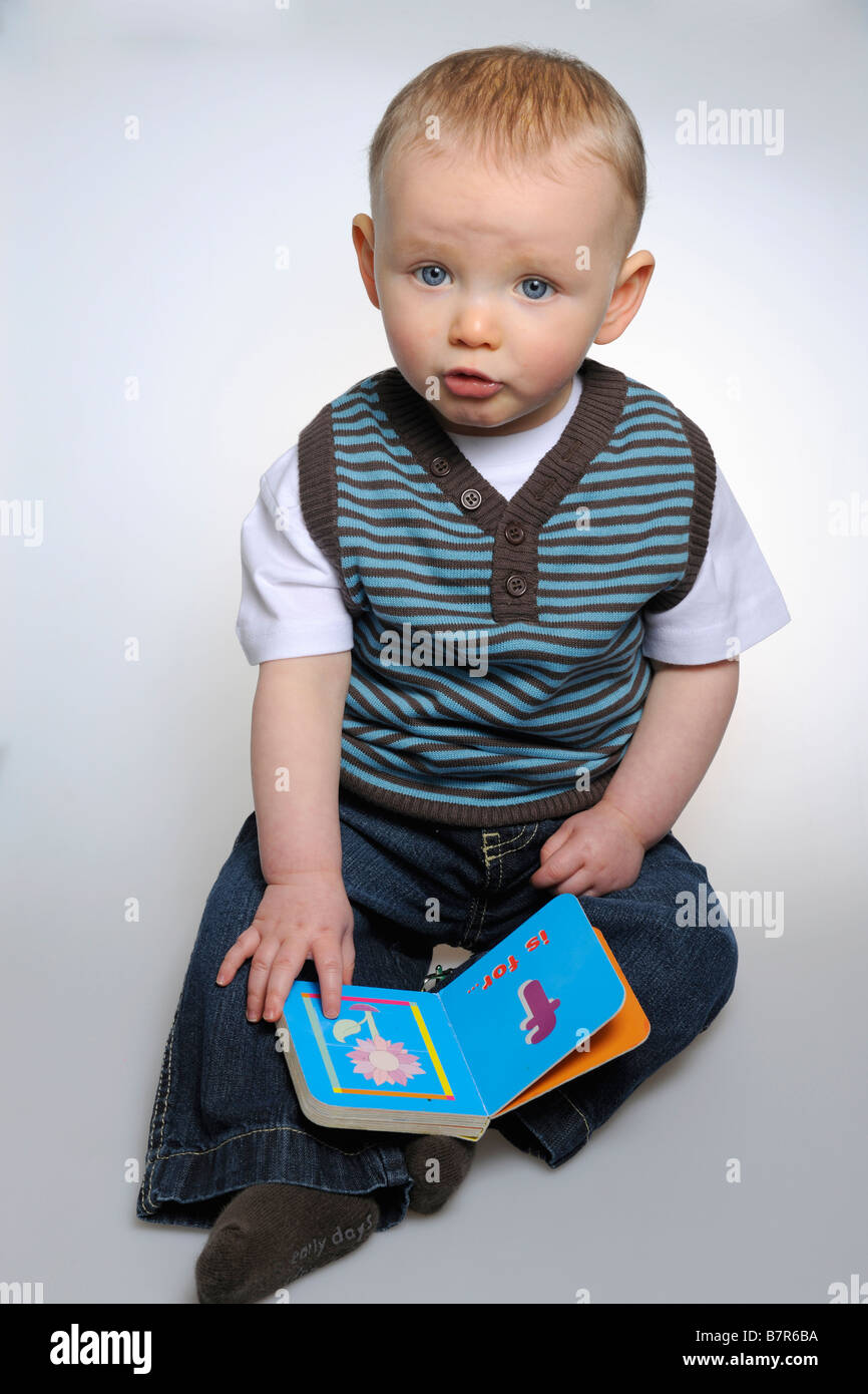 Boy reading alphabet book Stock Photo