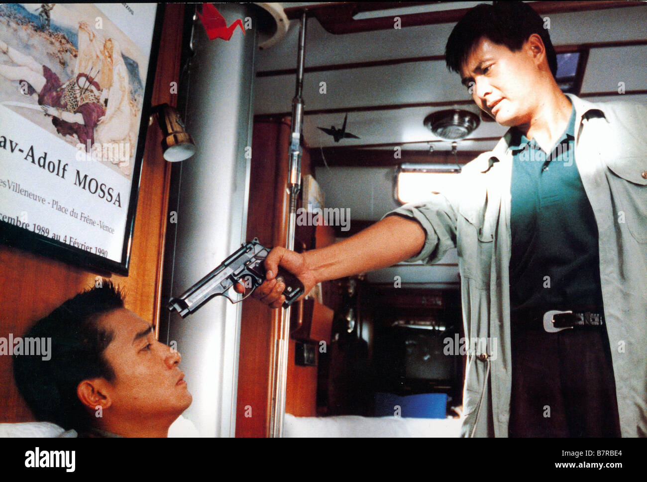 Lat sau san taam  Hard Boiled Year: 1992 - Hong Kong Director: John Woo Yun-Fat Chow, Tony Leung Chiu Wai Stock Photo