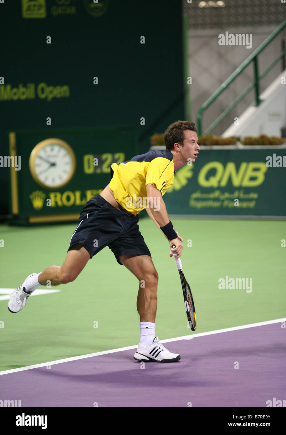 German tennis star Phillip Kholschreiber in action against Roger Federer at the Qatar Open January 2009 Stock Photo