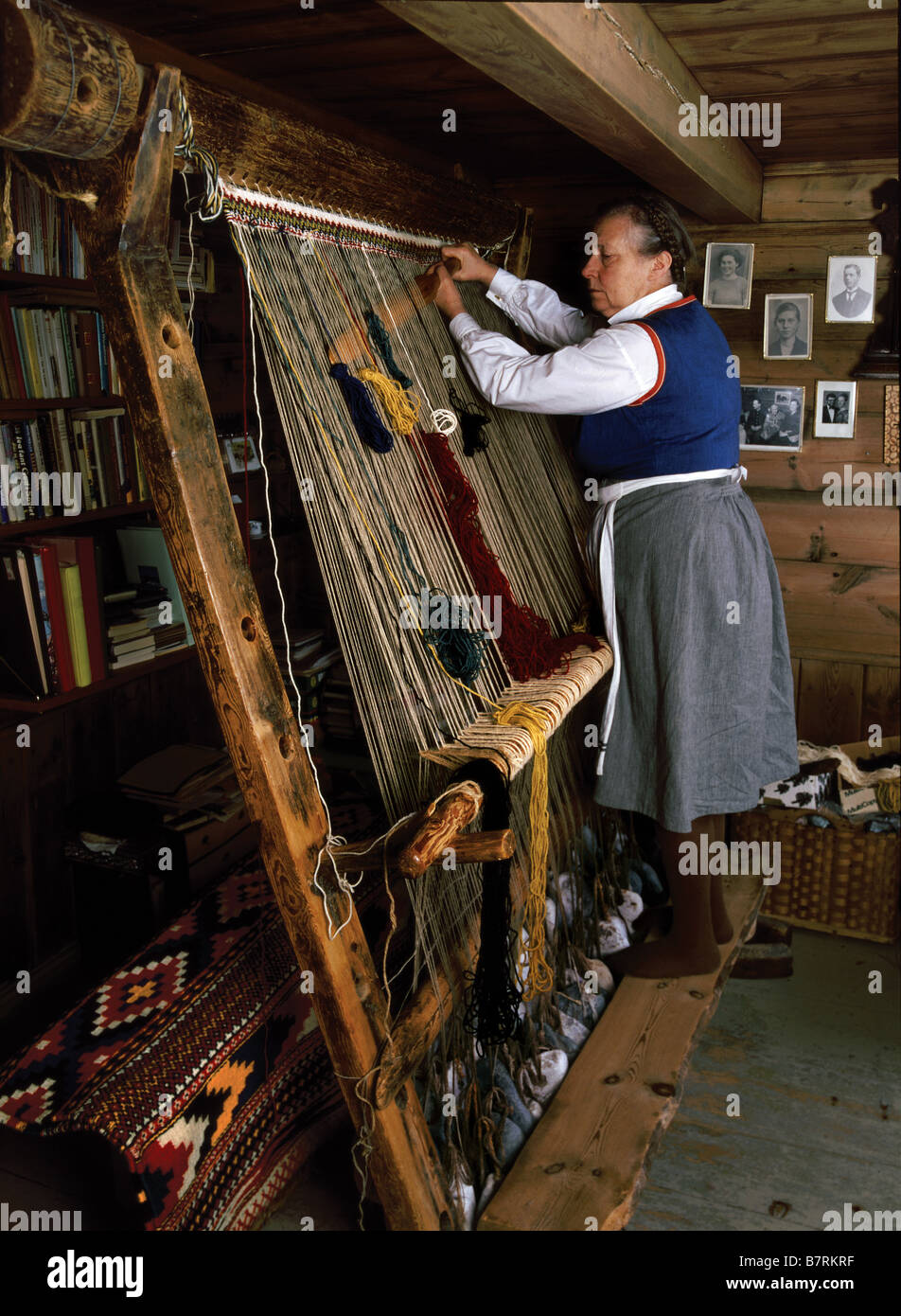 Weaving on a Warp-Weighted Loom. The Norwegian artist, Berta Liarbø, Fitjar. A weaving technique known back to 5500 BC. Stock Photo