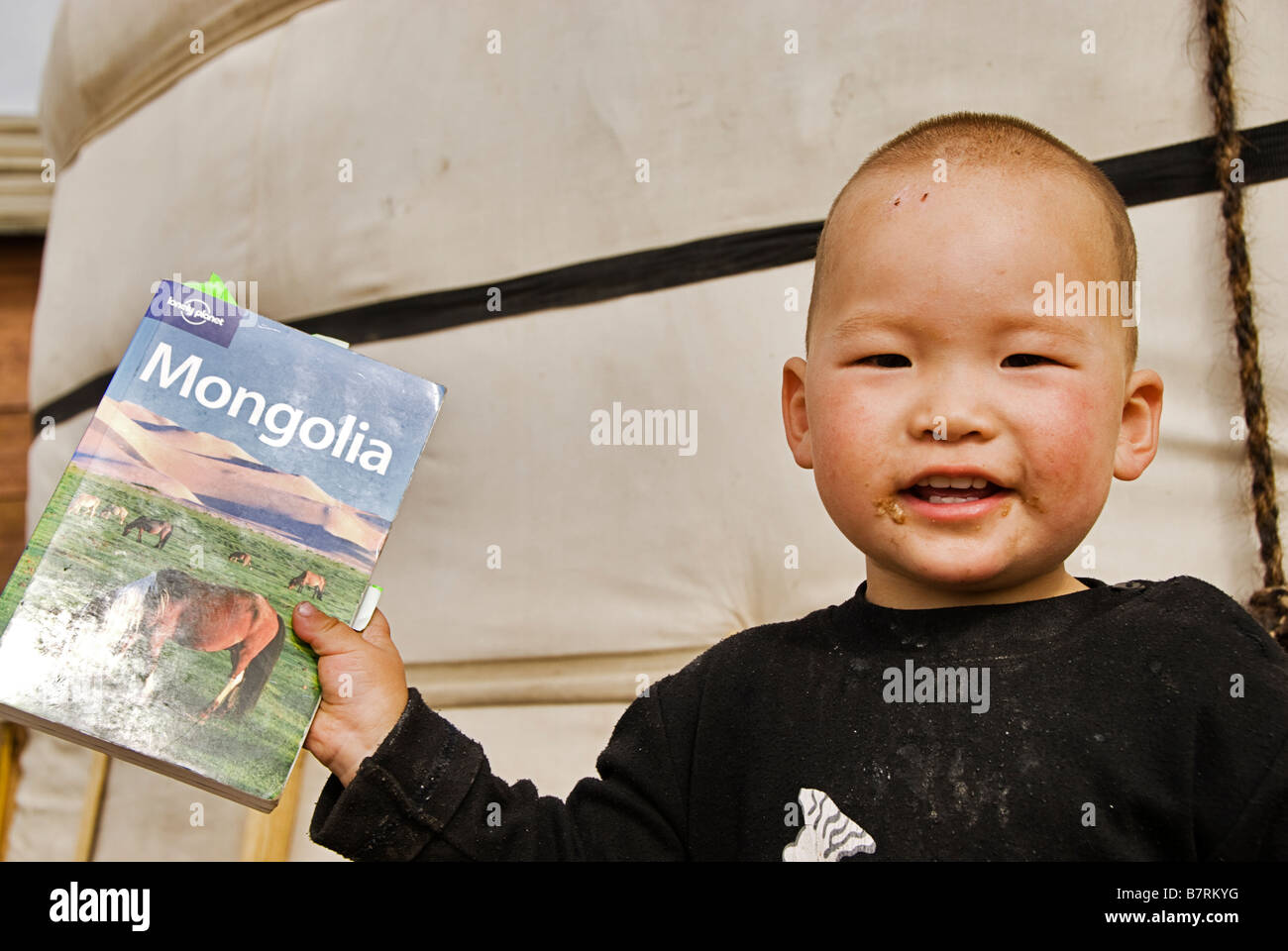 Kid with guidebook, Mongolia Stock Photo Alamy