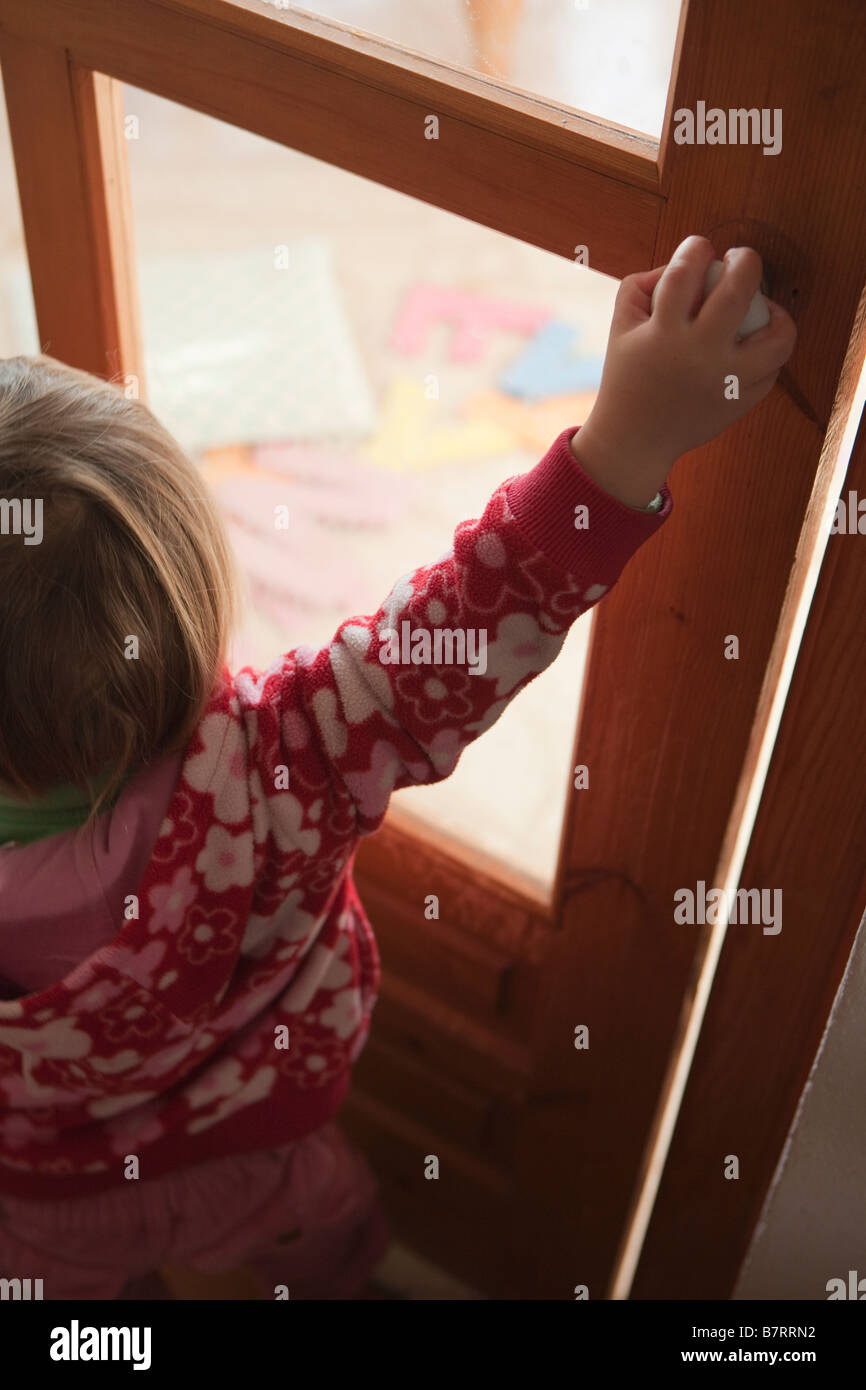 Child opening door Stock Photo Alamy