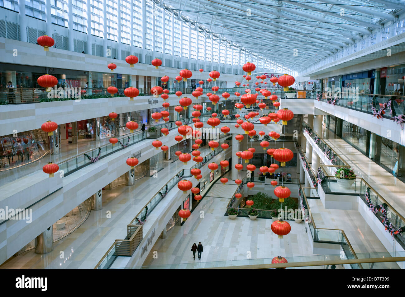 Interior of modern upmarket Seasons Place shopping mall in central Beijing China 2009 Stock Photo
