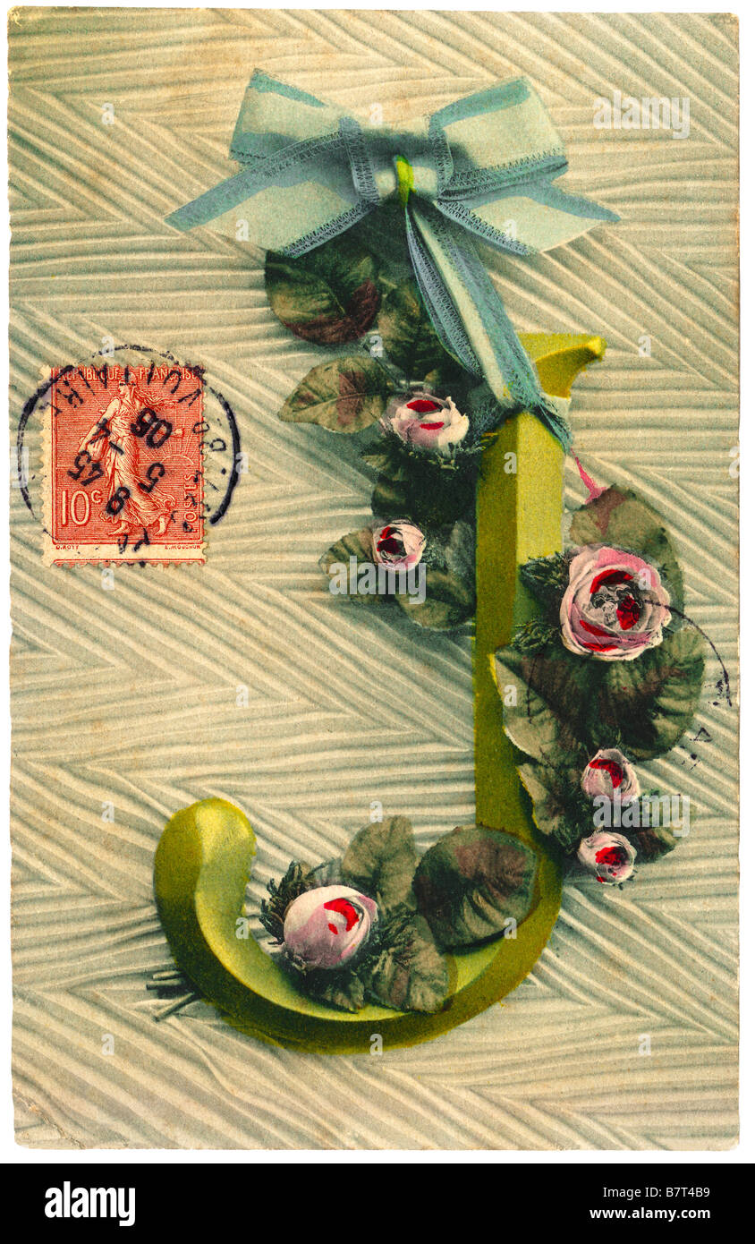 Circa 1905 French postcard depicting letter J entwined with roses and ribbon bow - France. Stock Photo