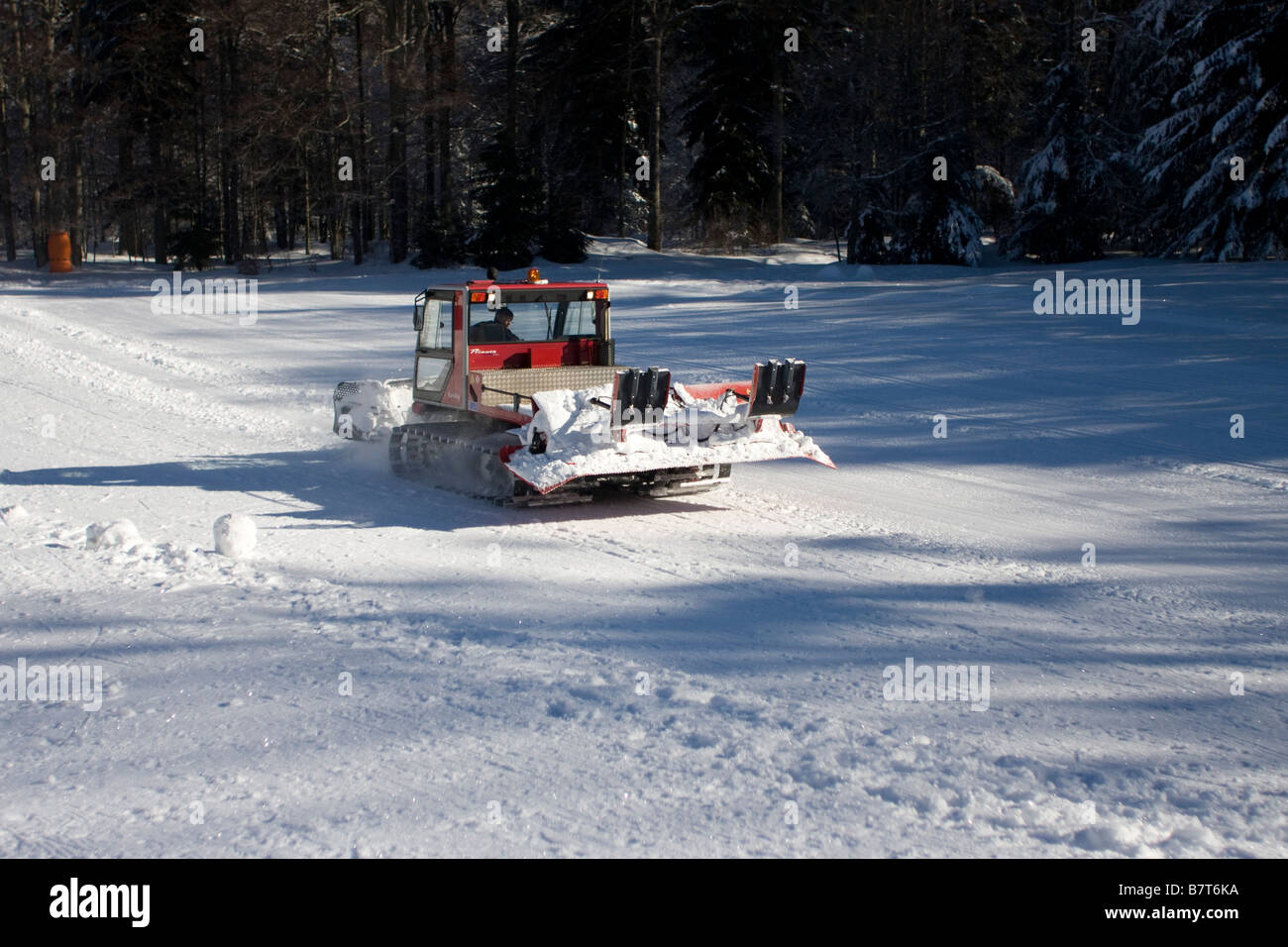 Snow plough caterpillar working on ski slope,dameuses,Winter col de l