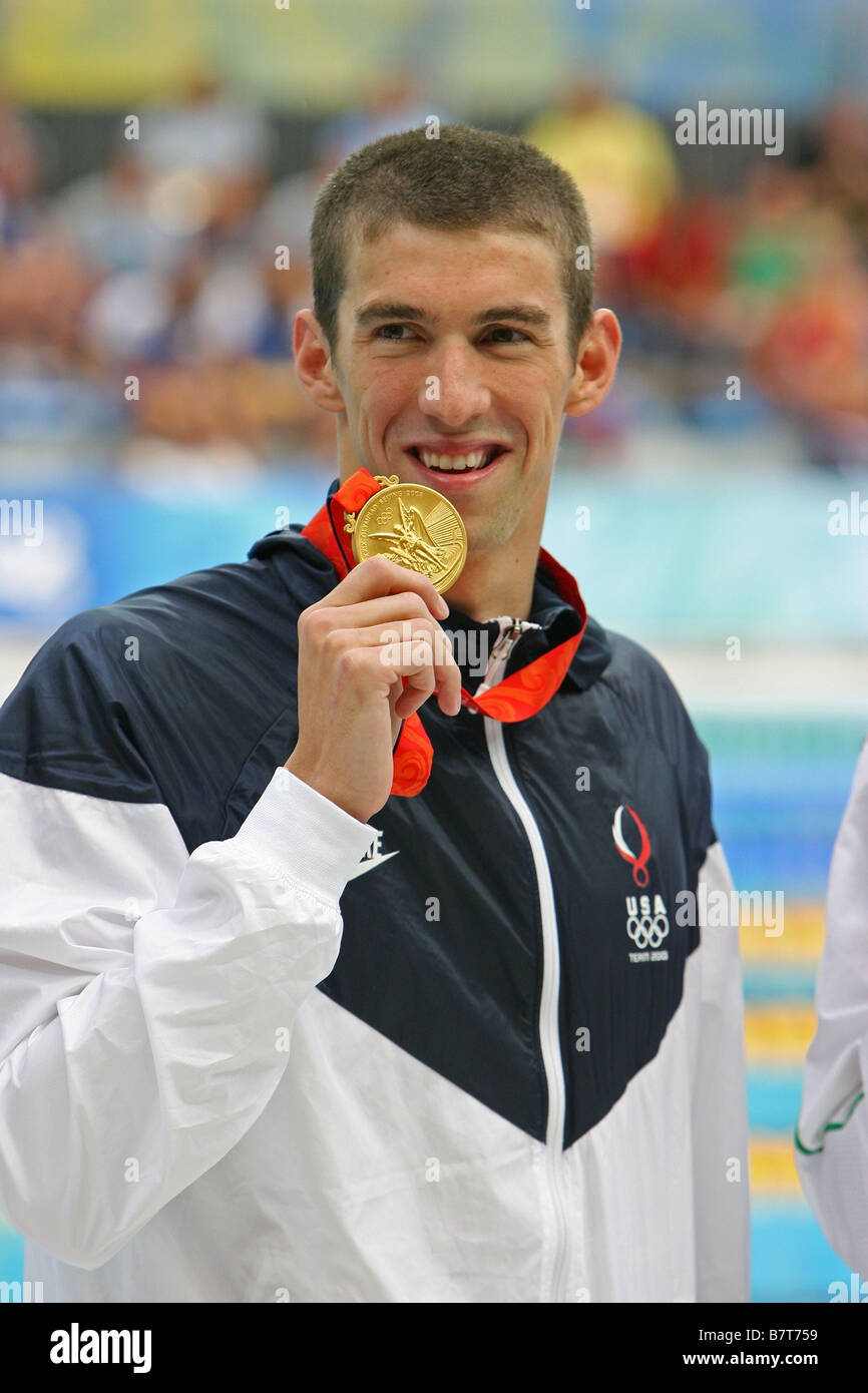Michael Phelps shows a gold medal at the Beijing Olympic Games Stock