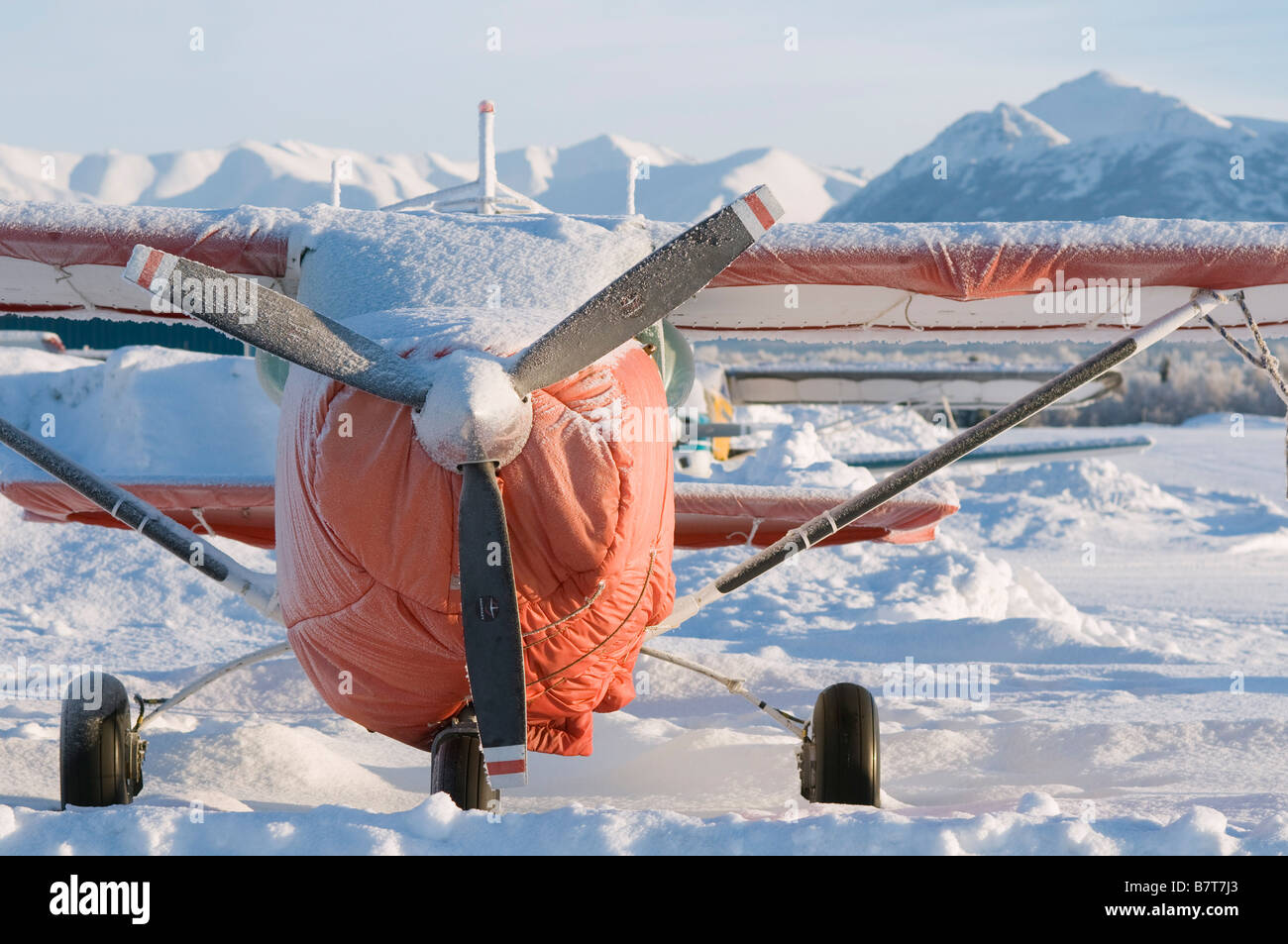 Snow covered Cessna 182 airplane, Merrill Field, Anchorage, Alaska Stock Photo