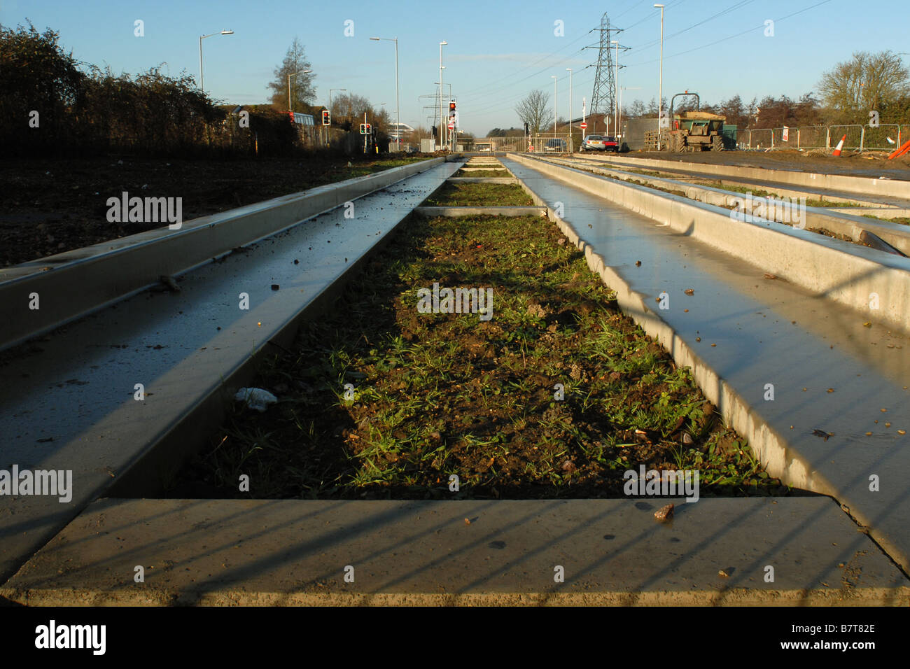 The Cambridgeshire Guided Busway shortly after topsoil has been laid between the tracks Stock Photo