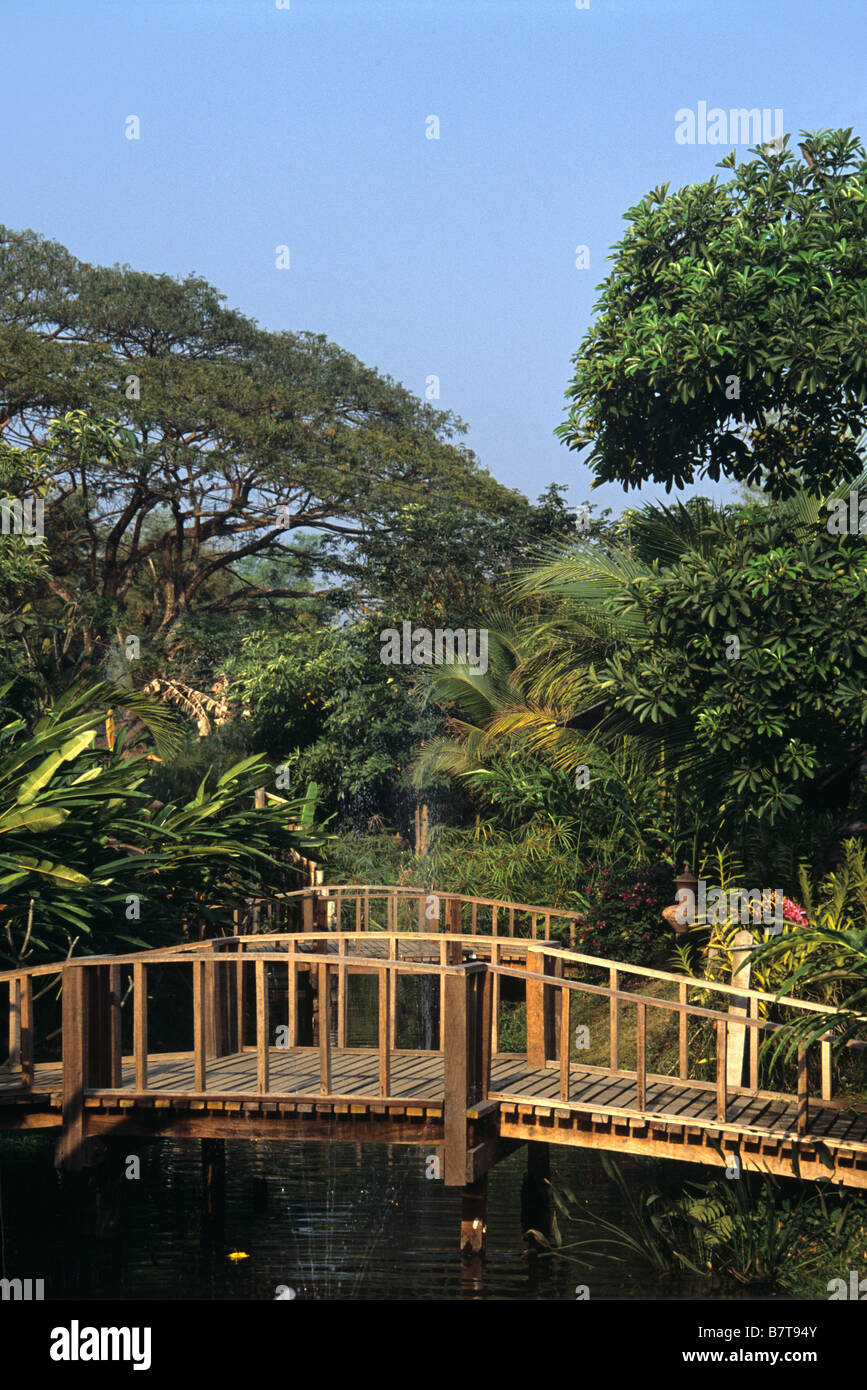 Footbridge over Pool at the Orchide Garden, Chiang Mai, Thailand Stock Photo