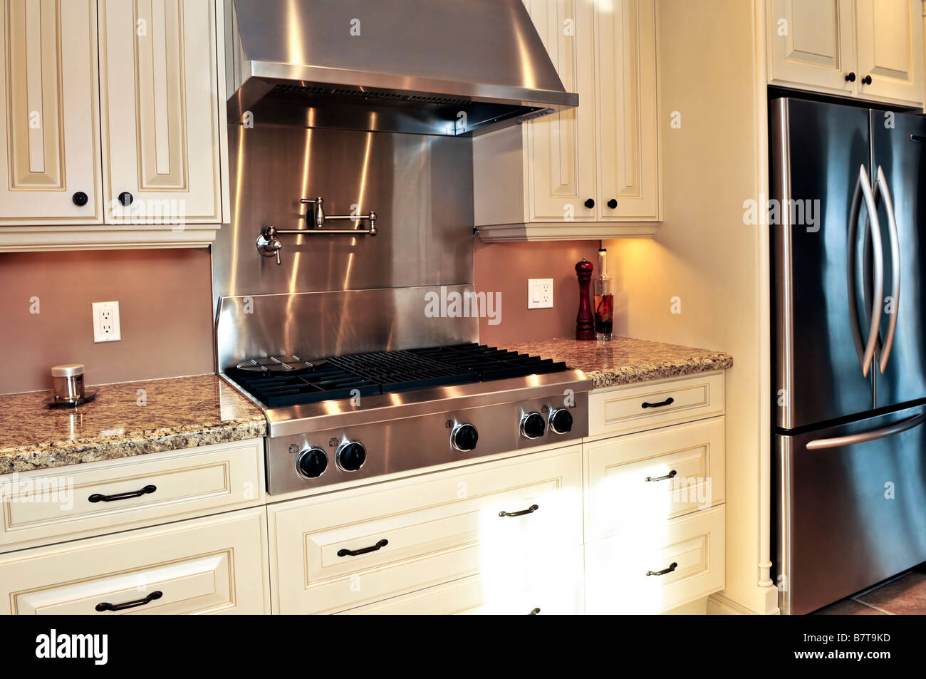 Interior of modern luxury kitchen with stainless steel appliances Stock Photo