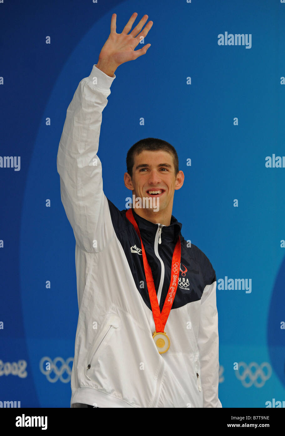 Michael Phelps waves to the public after receiving one of his eight gold medals at the Beijing Olympic Games Stock Photo