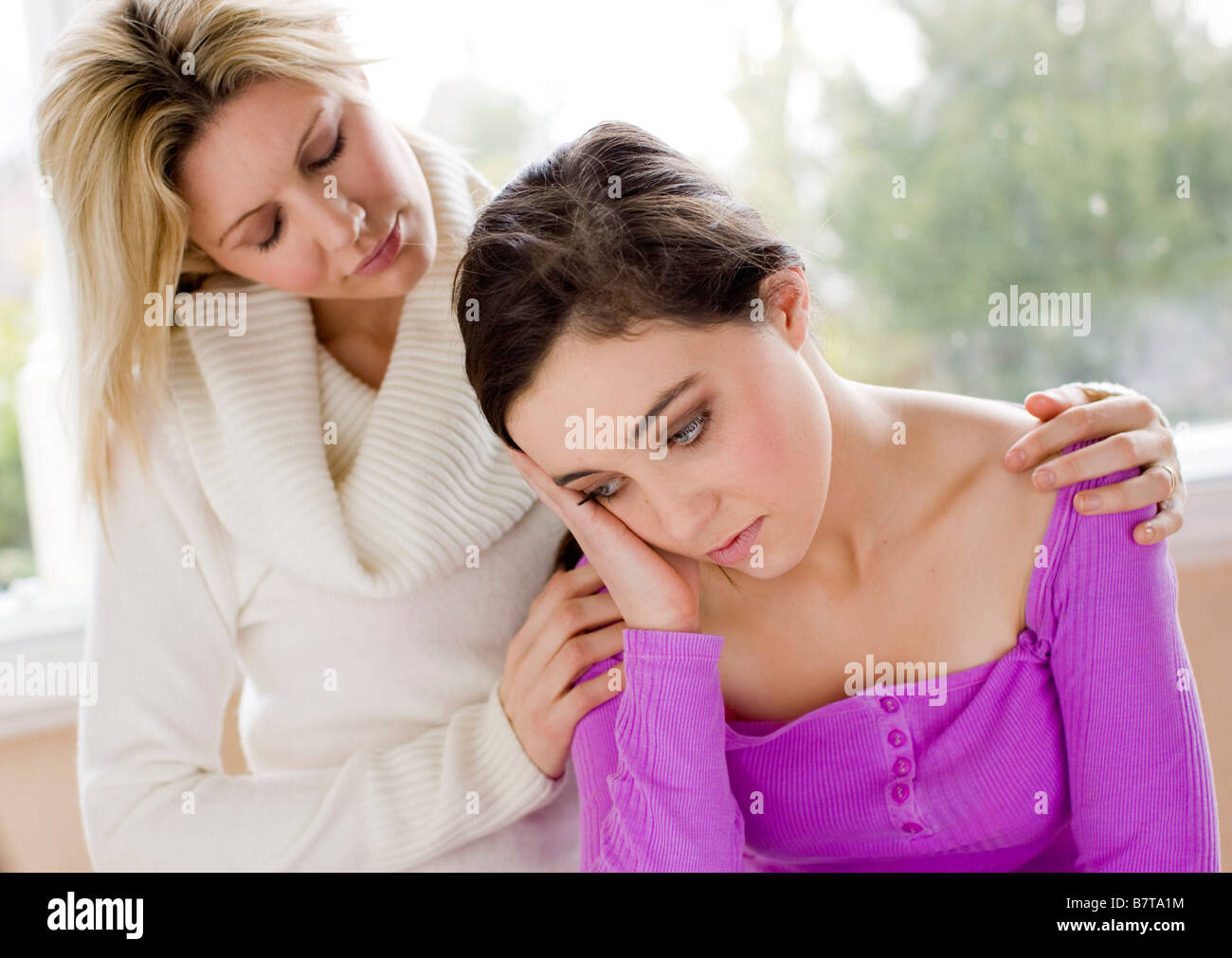 Mother consoling daughter Stock Photo