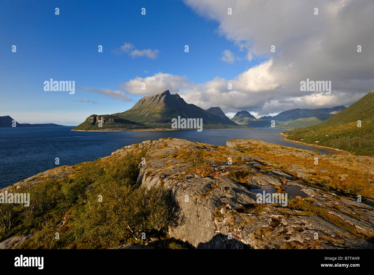 The island of Aldra with the Hjartinden peaks north west Norway Stock Photo