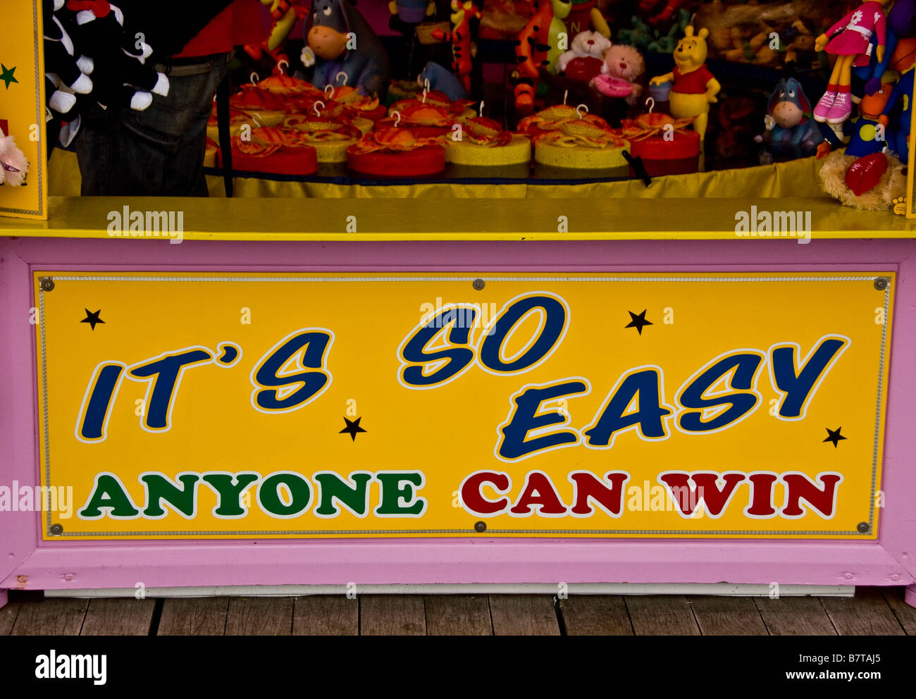 it's so easy anyone can win sign on seaside amusements. Llandudno. Wales Stock Photo