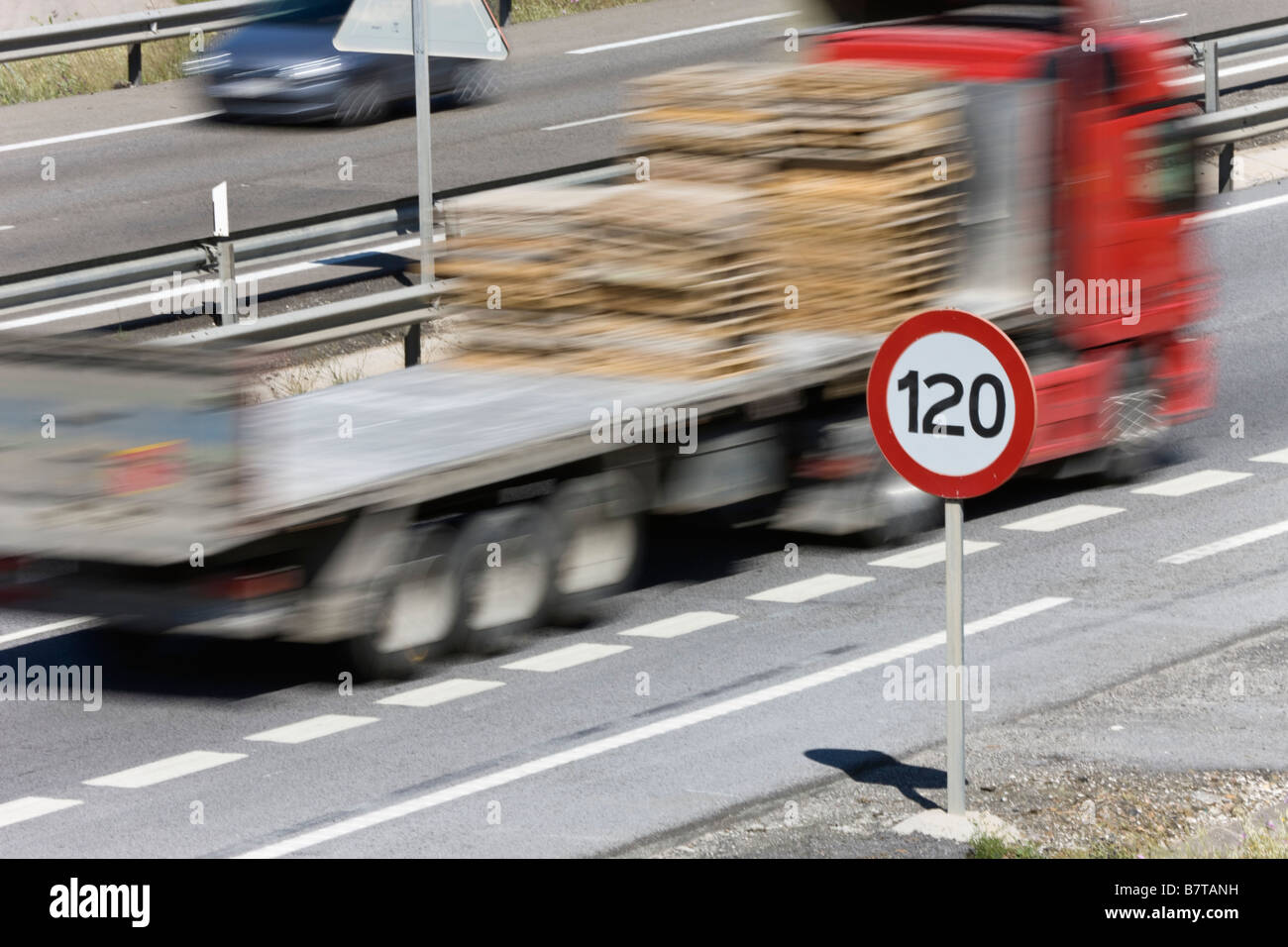Truck passing 120 kilometer per hour speed limit sign on motorway ...