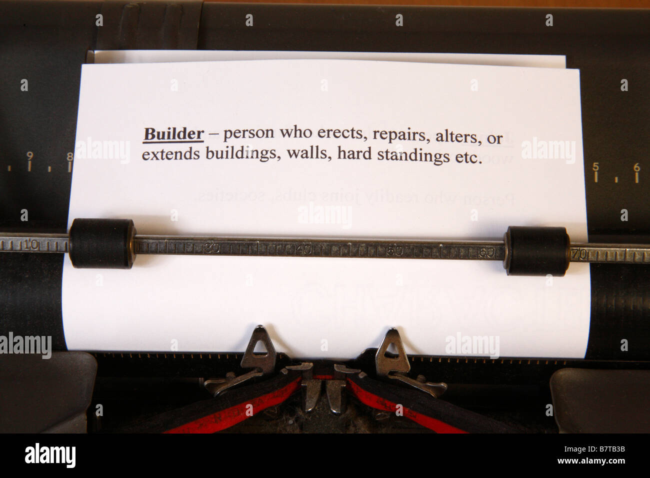 Definician of Builder in typewriter Stock Photo - Alamy