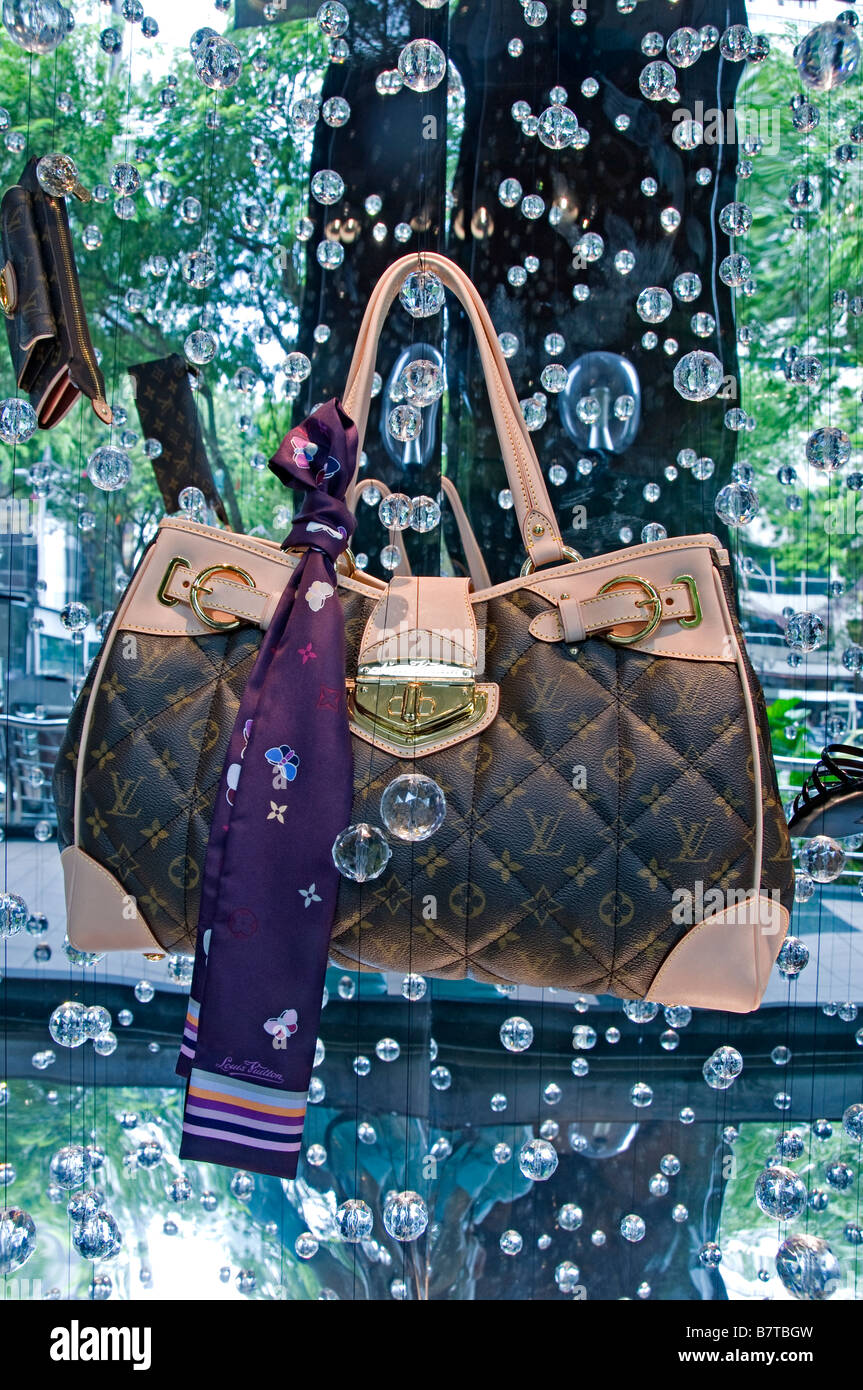 Louis Vuitton bag show window display Singapore Orchard road modern fashion  luxury shopping mall shop store shops stores Stock Photo - Alamy