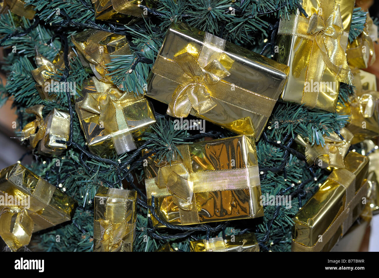 gold golden present boxes gifts celebration christmas tree Stock Photo