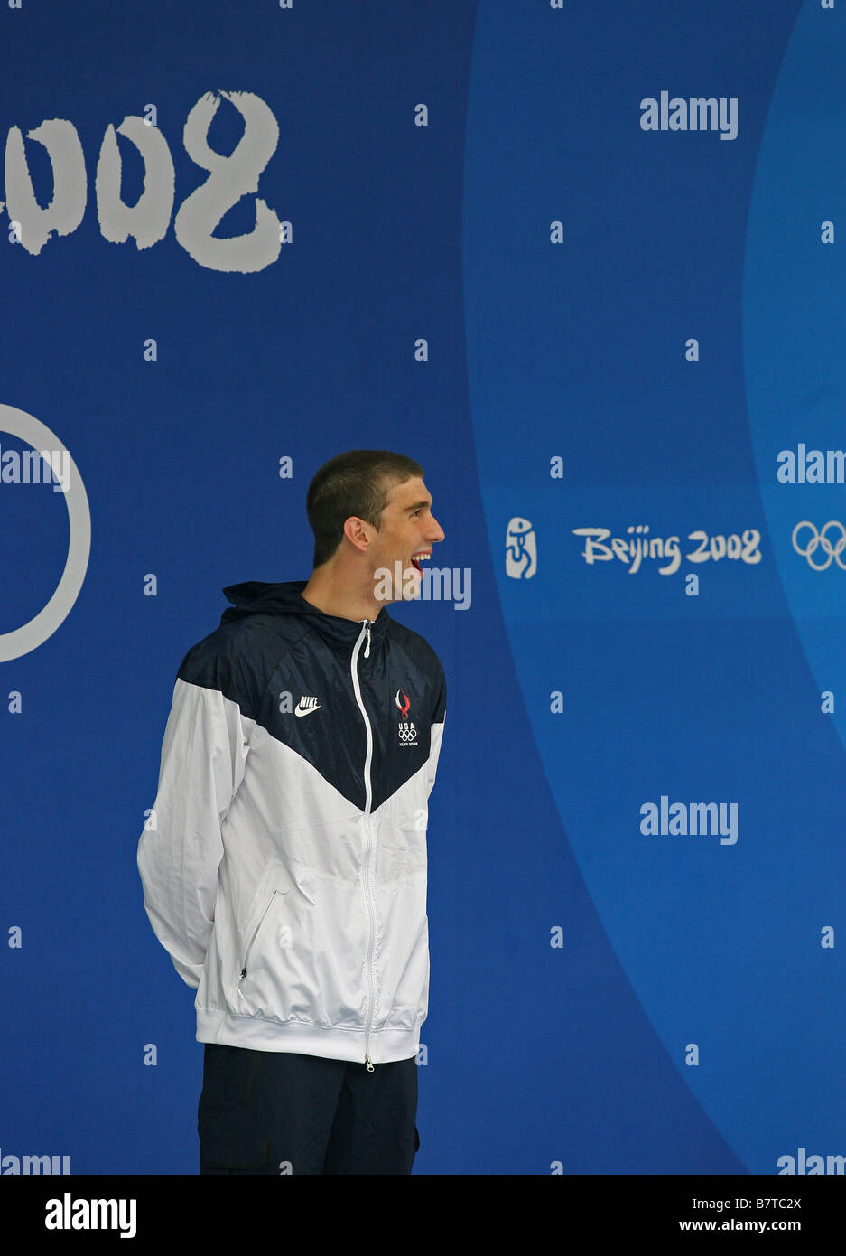 Michael Phelps laughs during the medal ceremony of one of his eight gold medals at the Beijing Olympic Games Stock Photo