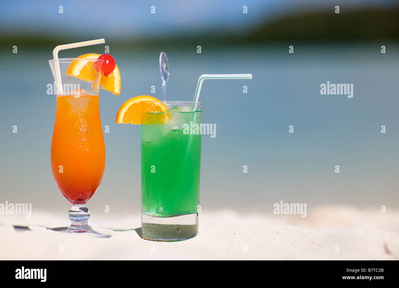 Two tropical cocktails on white sand beach Stock Photo
