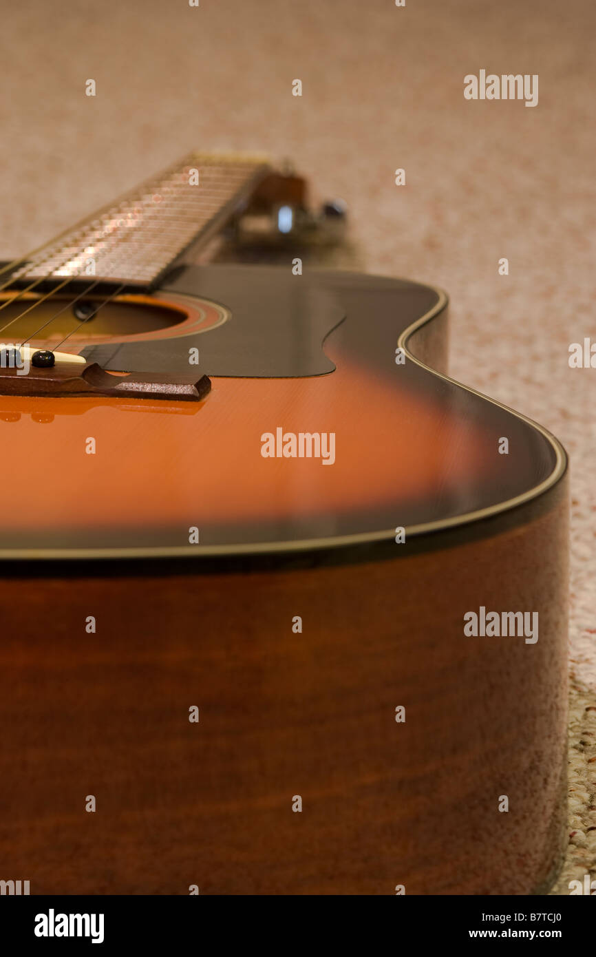 An acoustic guitar profile shot. Stock Photo