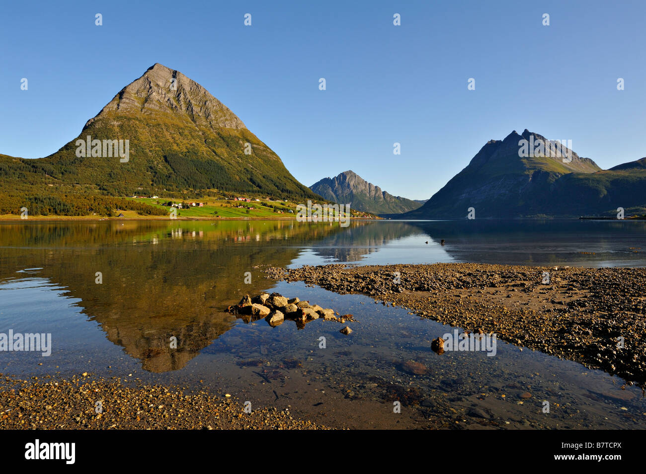 The island of Aldra with the Hjarttinden and Liatinden peaks from the shore at Haugland north west Norway Stock Photo