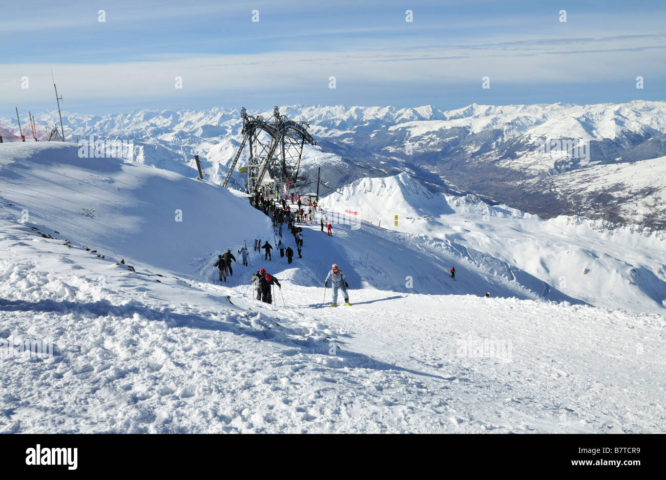 L'Aiguille Rouge summit showing cable car gondola station and skiers, Les Arcs, France Stock Photo