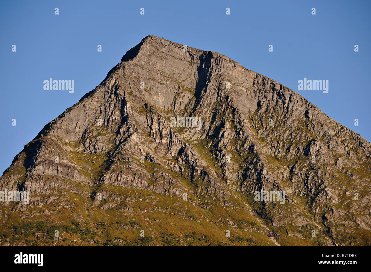 The rocky summit of Hjarttinden on the island of Aldra north west Norway Stock Photo