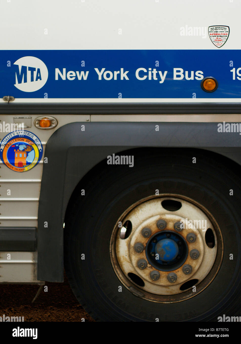 Wheel and side of a New York City MTA bus showing MTA logo. Stock Photo