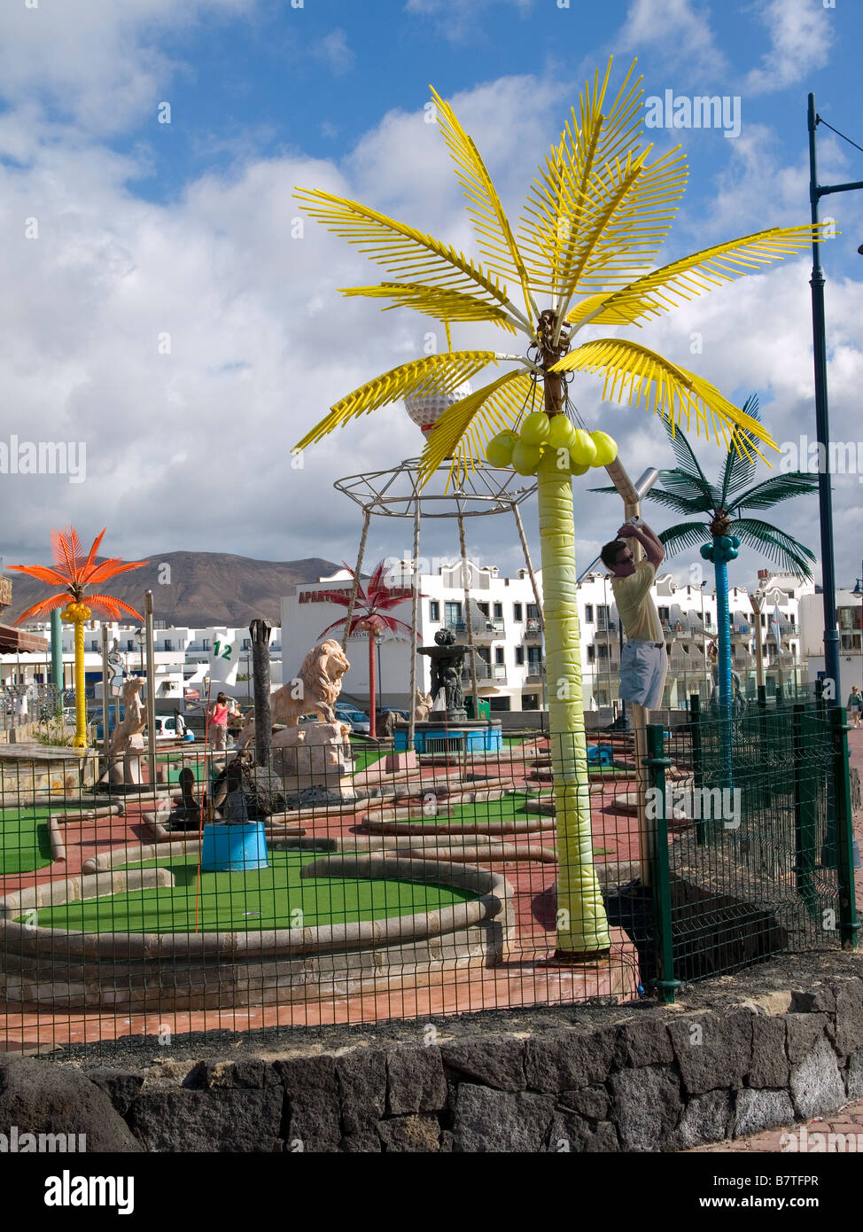 Plastic Palm Trees Decorate A Miniature Golf Course In Playa