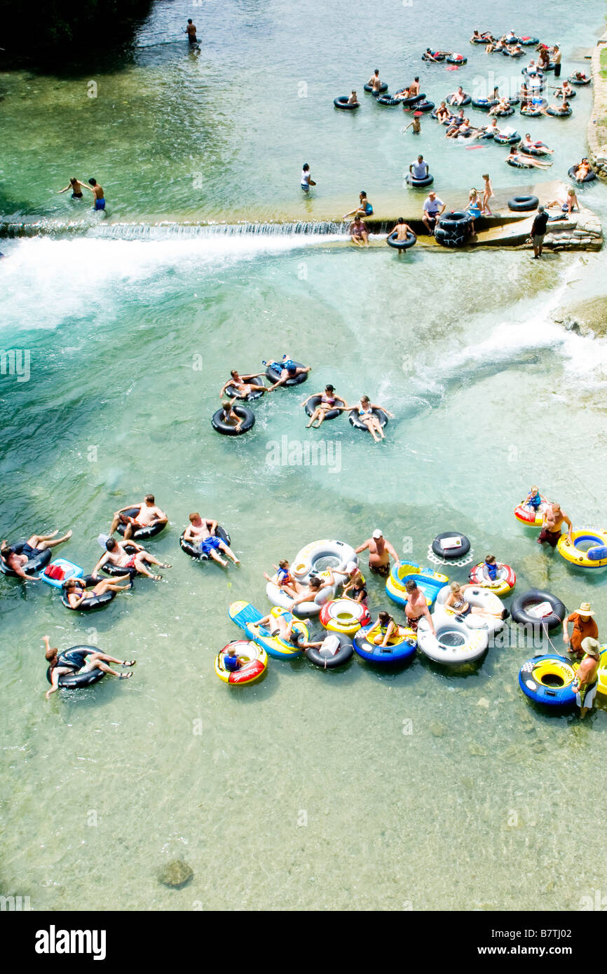 People tubing the chute on the Guadalupe River in New Branfels Texas