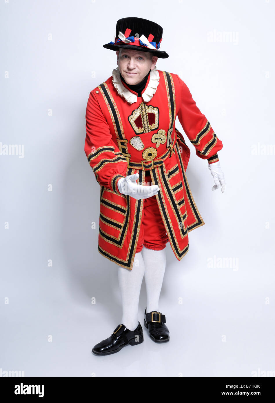 Beefeater bowing in welcoming gesture Stock Photo