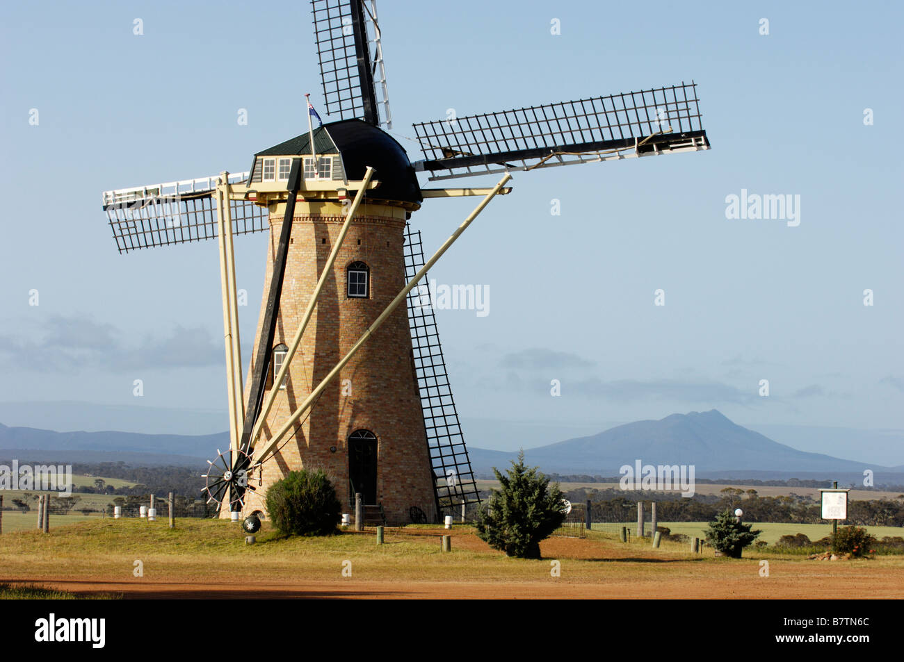 'The Lily', a traditional Dutch windmill, seen against a backdrop of the Stirling Range National Park, Western Australia. Stock Photo