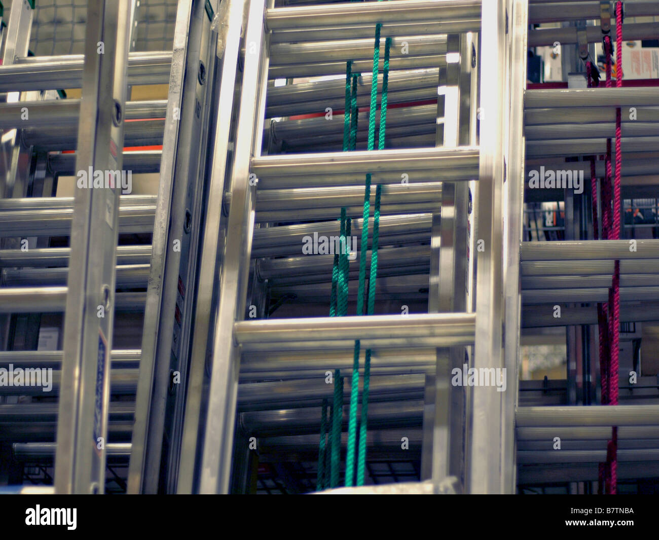 Aluminum ladders on display for sale at an industrial supply warehouse