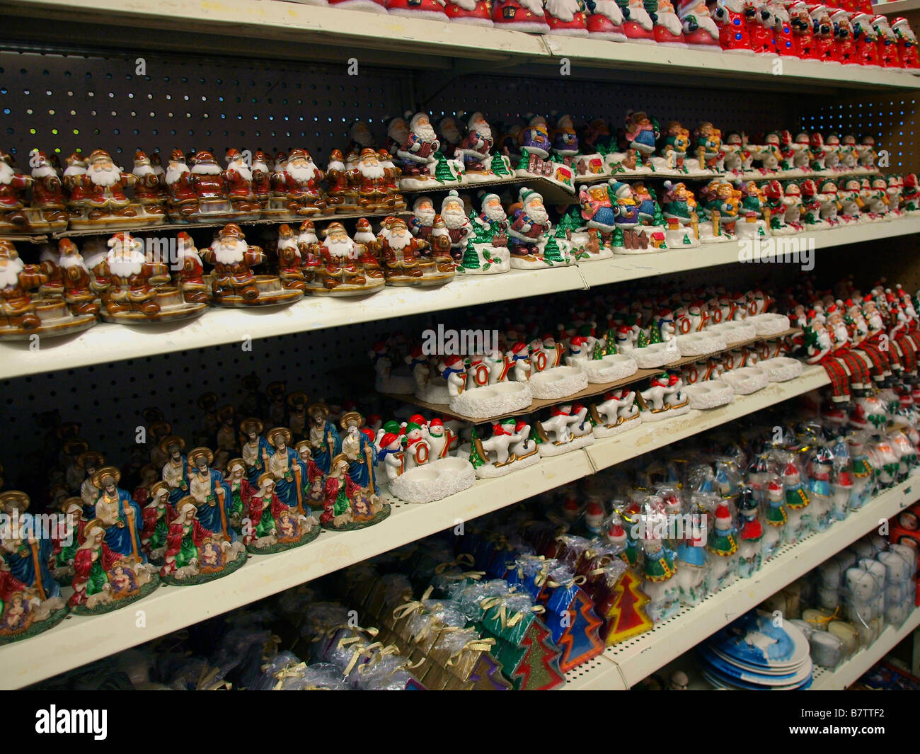 Inexpensive holiday figurines on display for retail sale. Stock Photo
