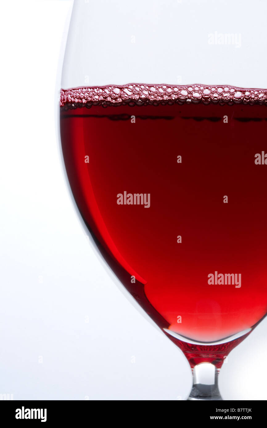 A glass of red wine on white background Stock Photo - Alamy