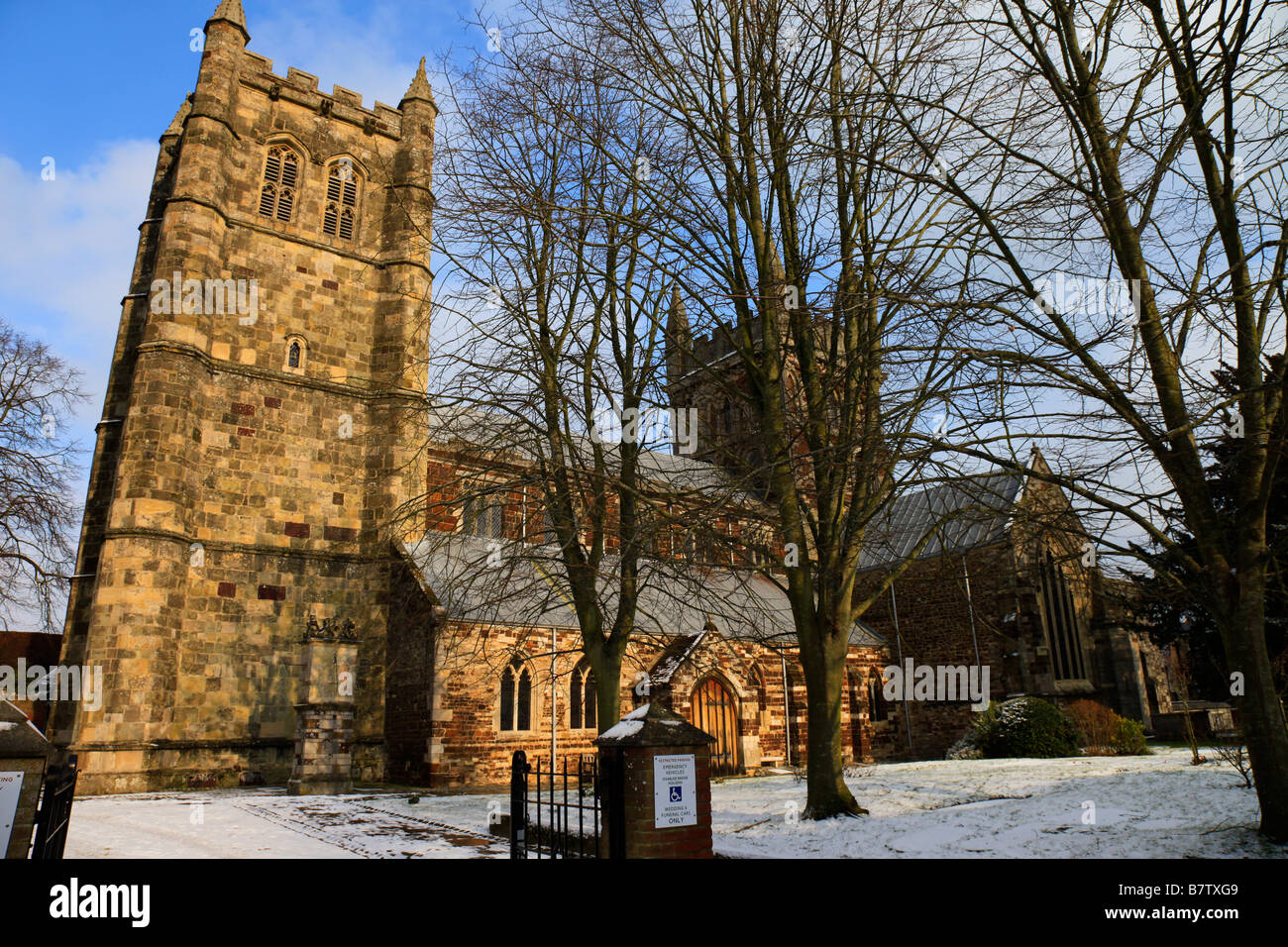 Wimborne Minster Dorset religious establishment, Church in winter snow Stock Photo