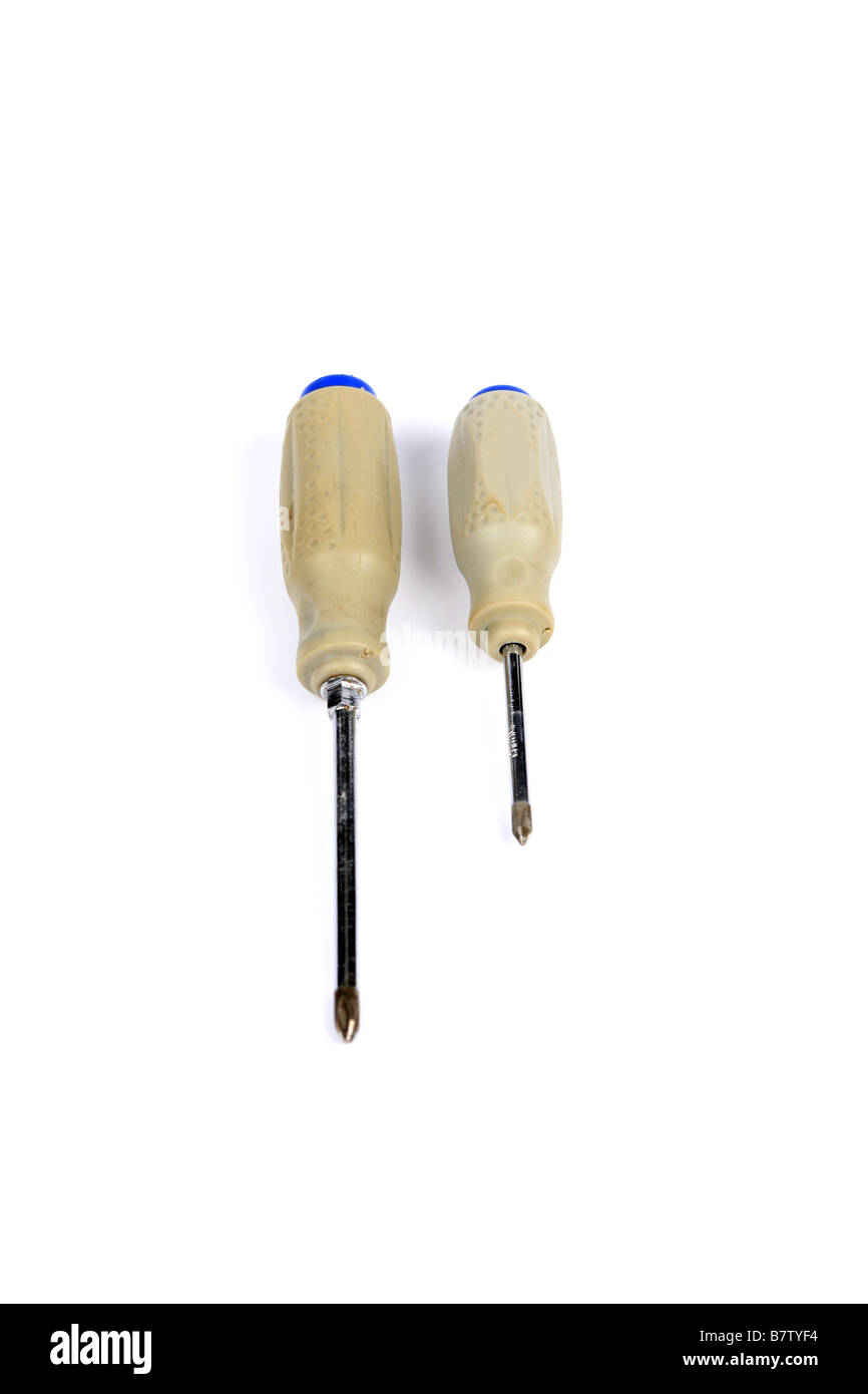 A pair of cross head screw drivers against a white background Stock Photo